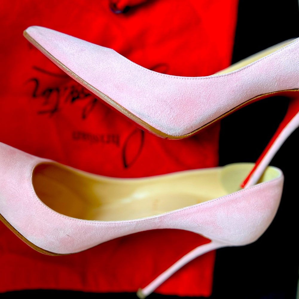 Christian Louboutin Pigalle Follies pink suede pumps.